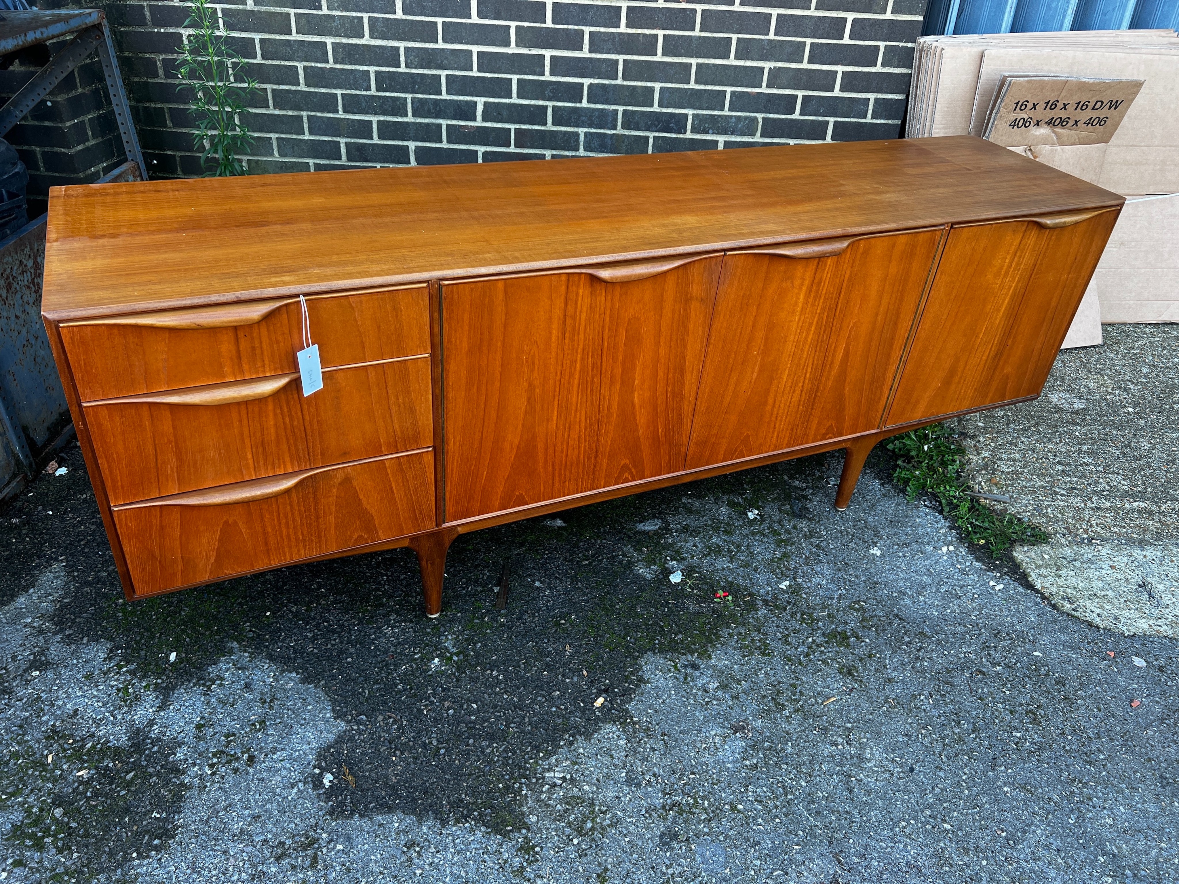 A. H. McIntosh & Co. A Dunvegan teak sideboard designed by Tom Robertson, length 201cm, depth 48cm, height 76cm